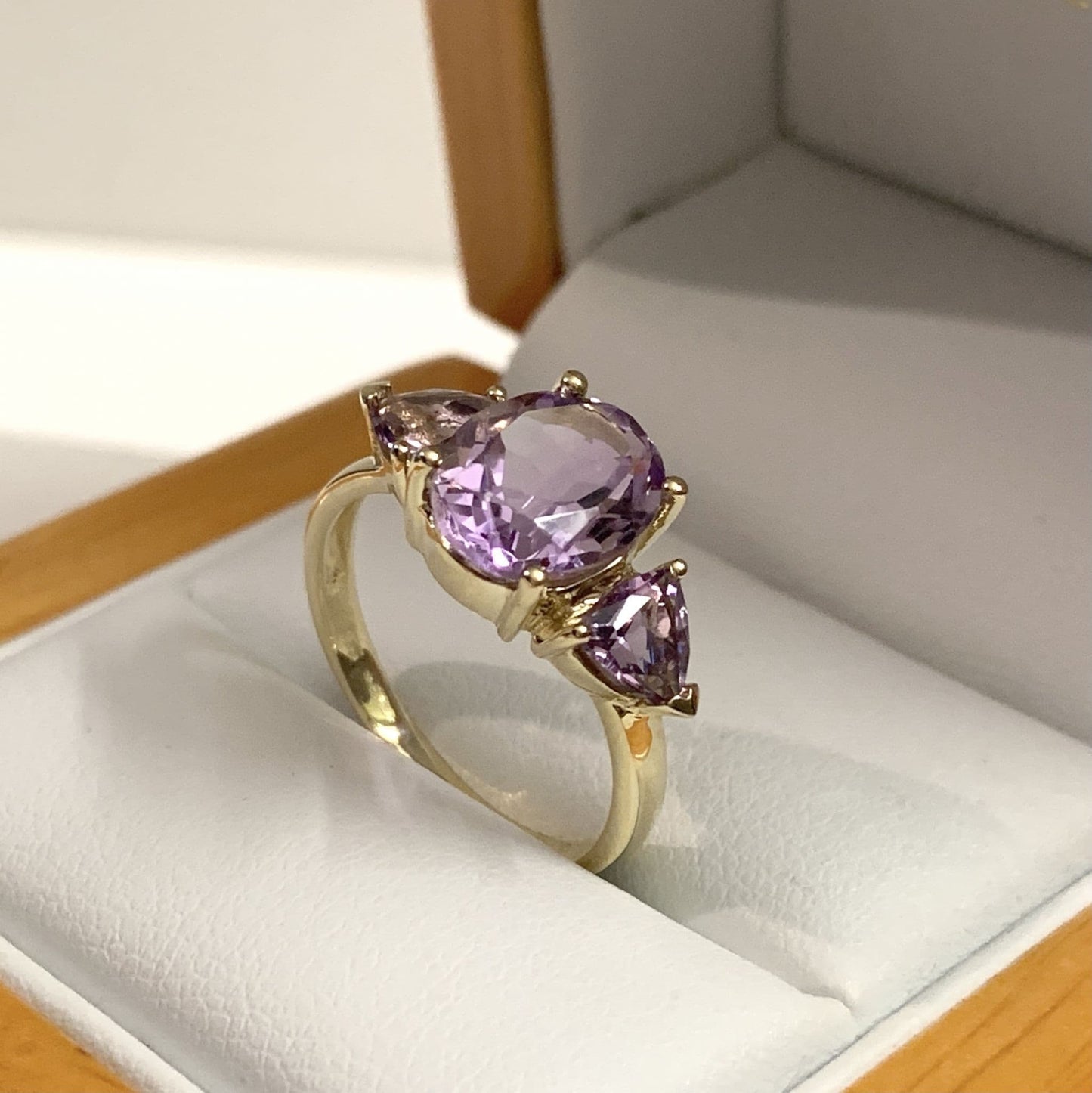 Purple amethyst trilogy dress ring yellow gold