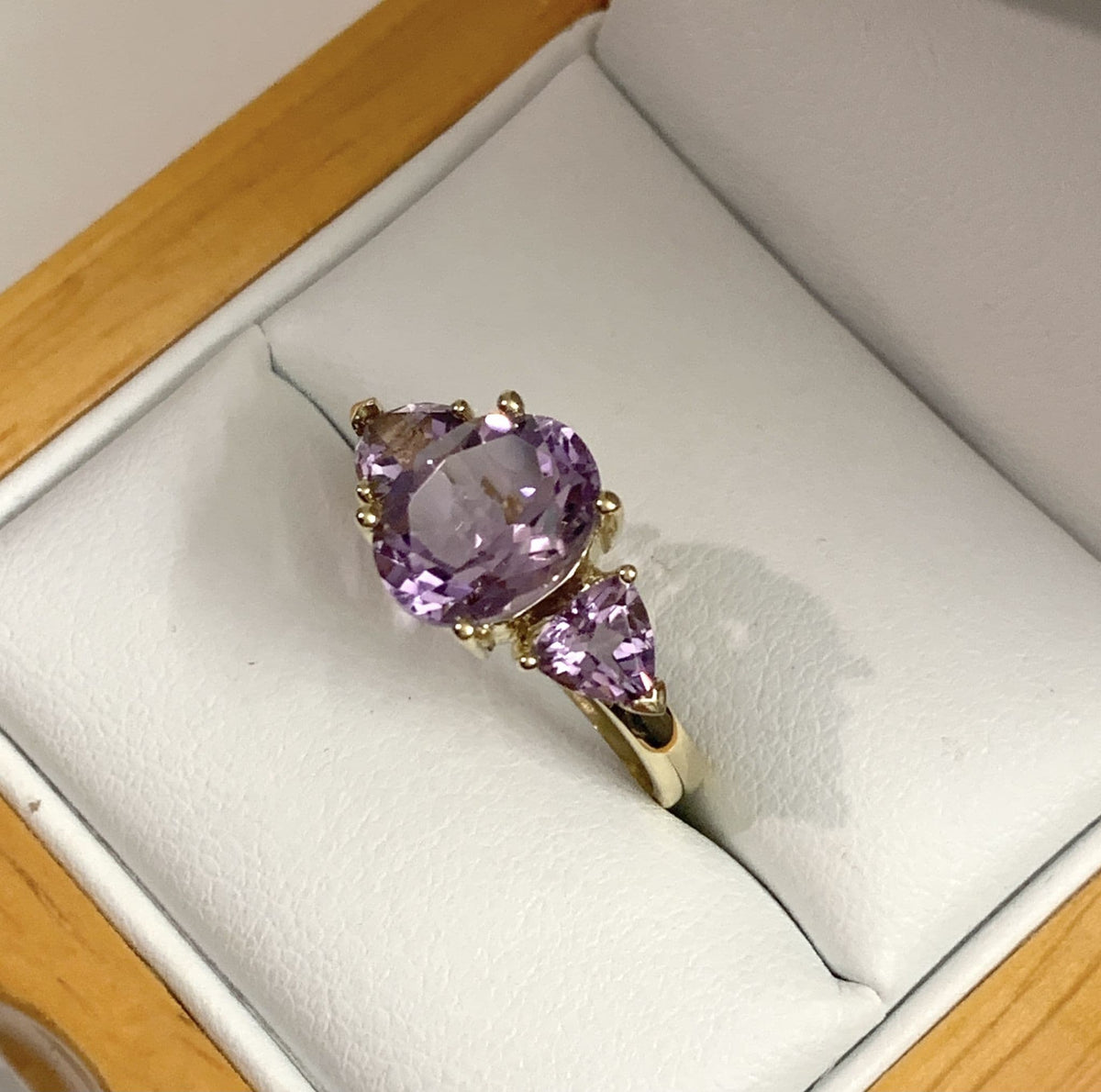 Purple amethyst trilogy dress ring yellow gold
