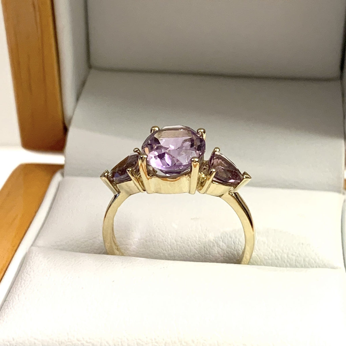 Purple amethyst trilogy dress ring yellow gold