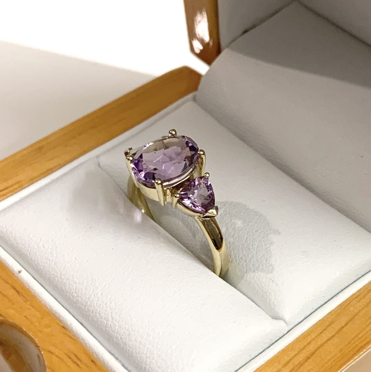 Purple amethyst trilogy dress ring yellow gold