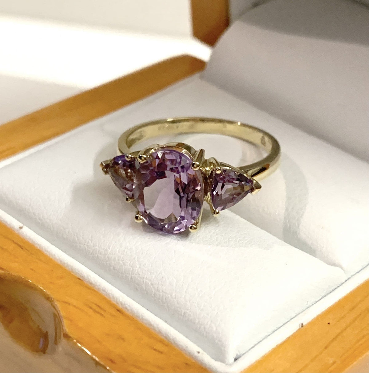 Purple amethyst trilogy dress ring yellow gold