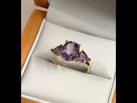 Purple amethyst trilogy dress ring yellow gold