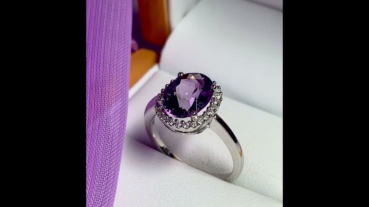 Purple oval amethyst and diamond white gold cluster ring
