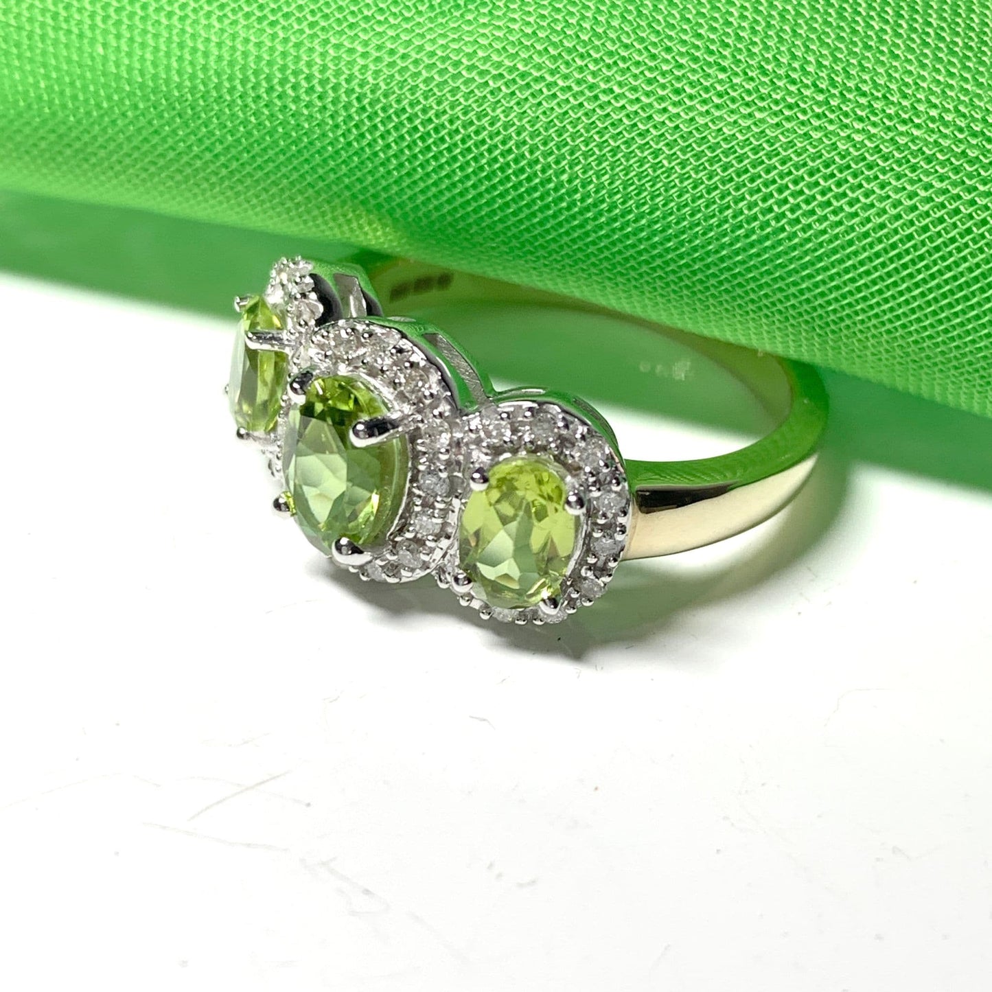 Trilogy Triple Oval Peridot and Diamond Yellow Gold Cluster Ring