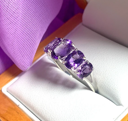 Amethyst dress ring with graduated stones
