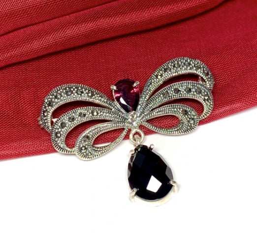 Ony And Jet Brooches