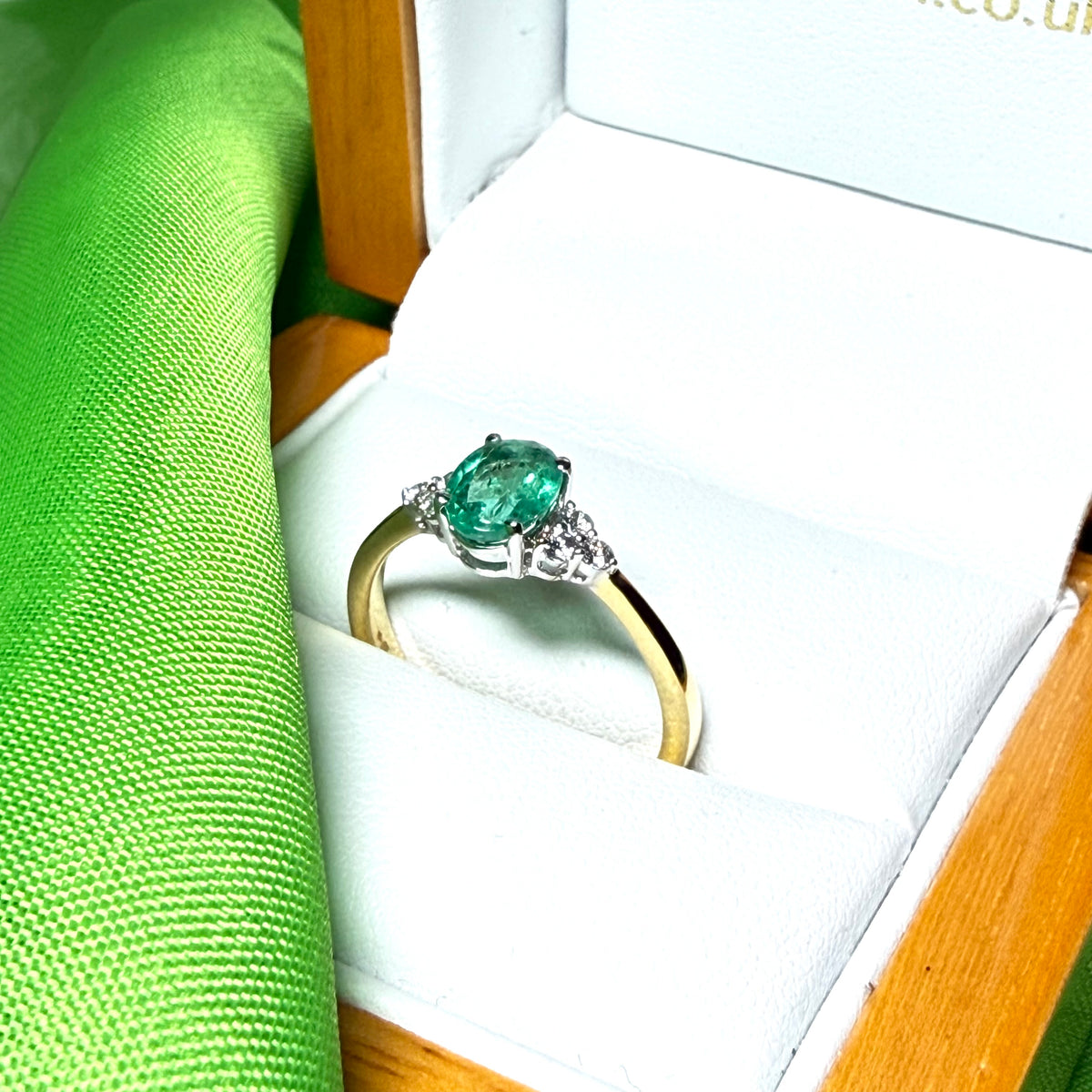 0.70 carat real green emerald and diamond 18 carat yellow gold oval trilogy dress ring