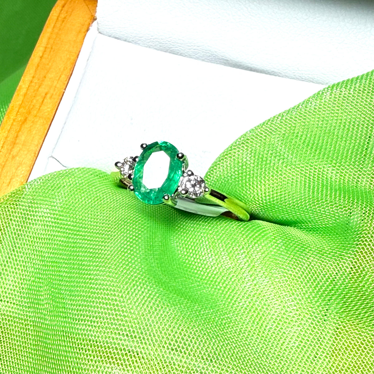 1.15 carat real green emerald and diamond 18 carat yellow gold oval trilogy dress ring