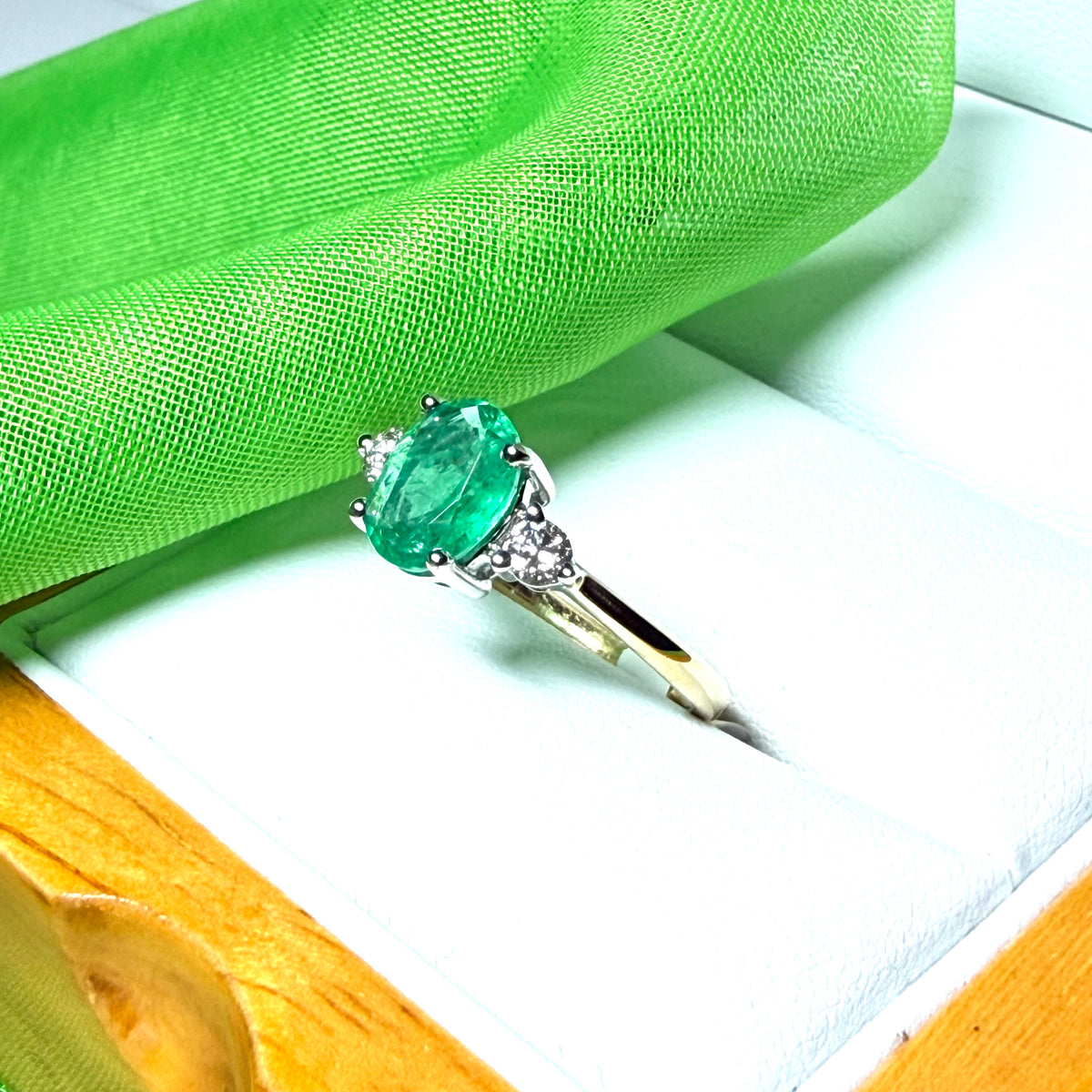 1.15 carat real green emerald and diamond 18 carat yellow gold oval trilogy dress ring