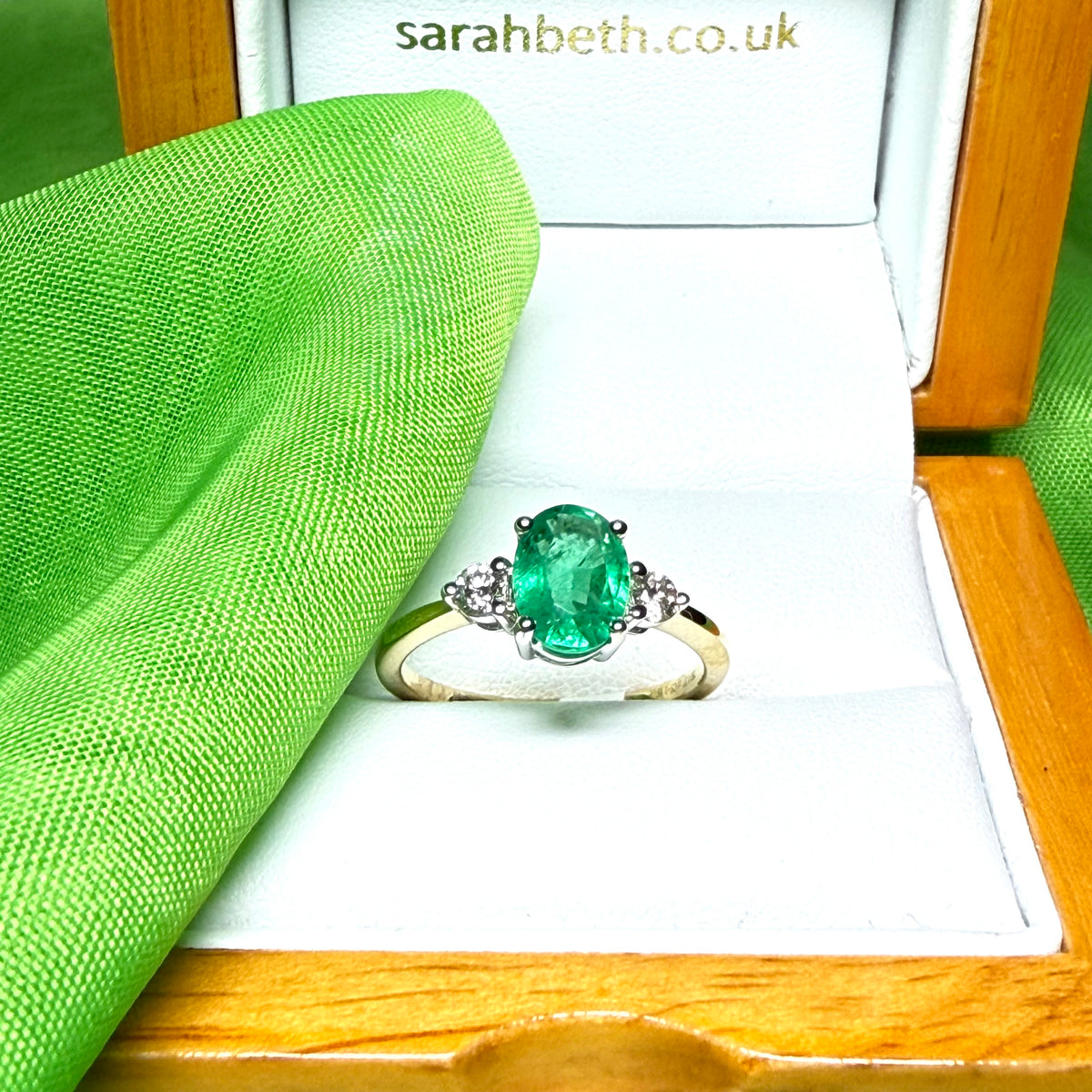 1.15 carat real green emerald and diamond 18 carat yellow gold oval trilogy dress ring
