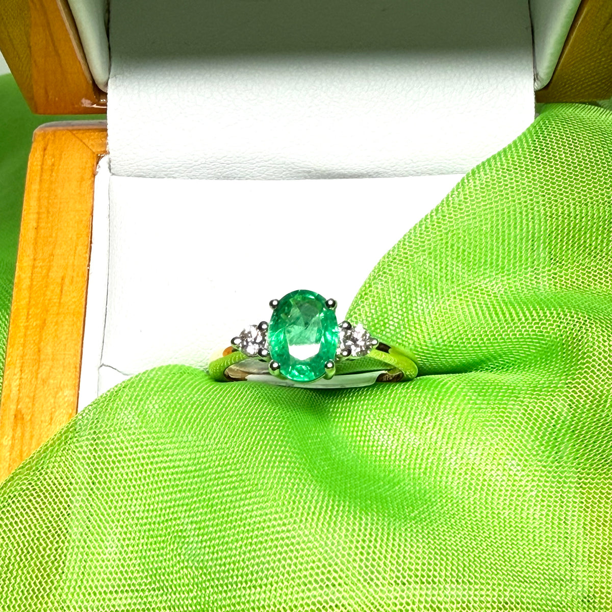 1.15 carat real green emerald and diamond 18 carat yellow gold oval trilogy dress ring