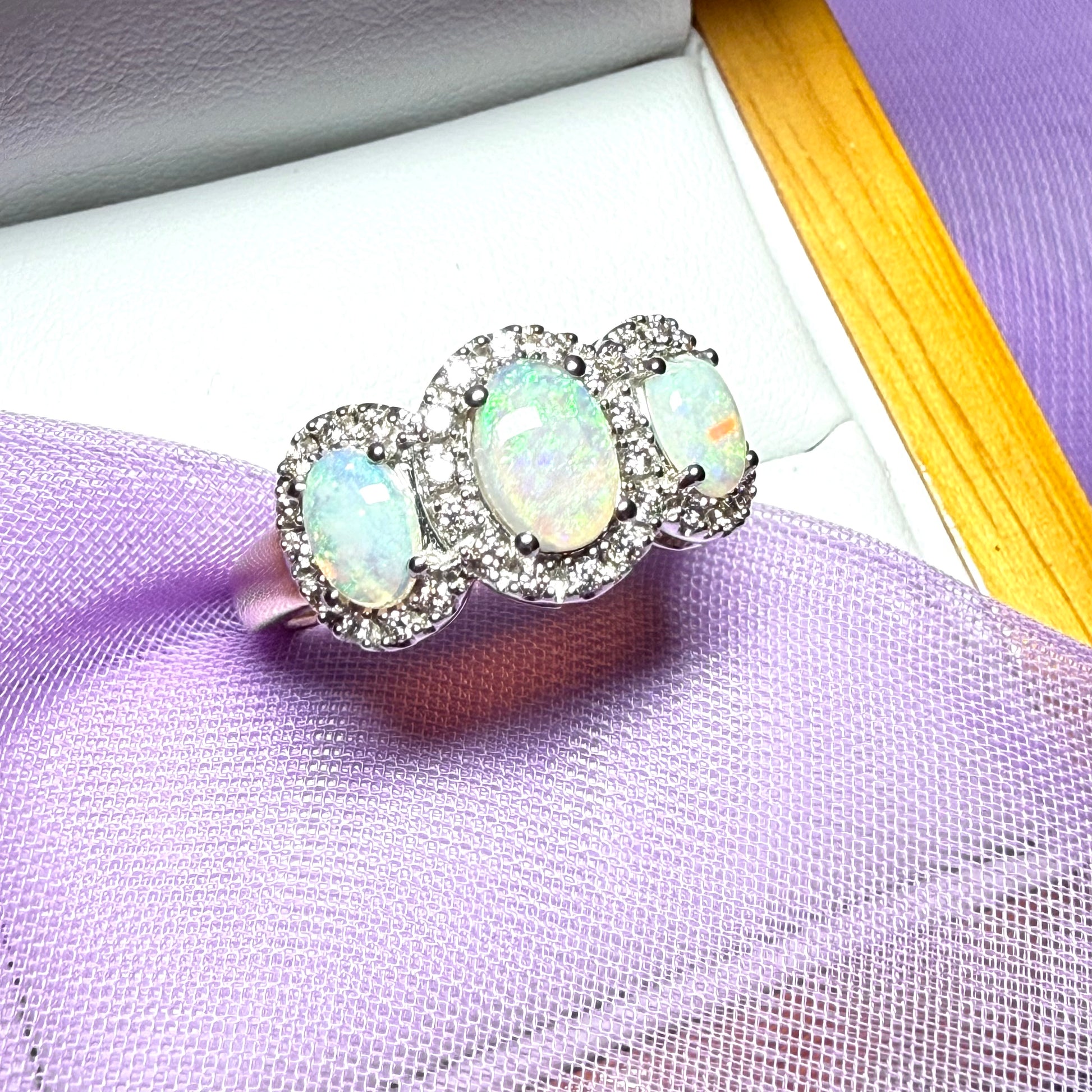 Gold oval cut three real opal and diamond trilogy cluster ring