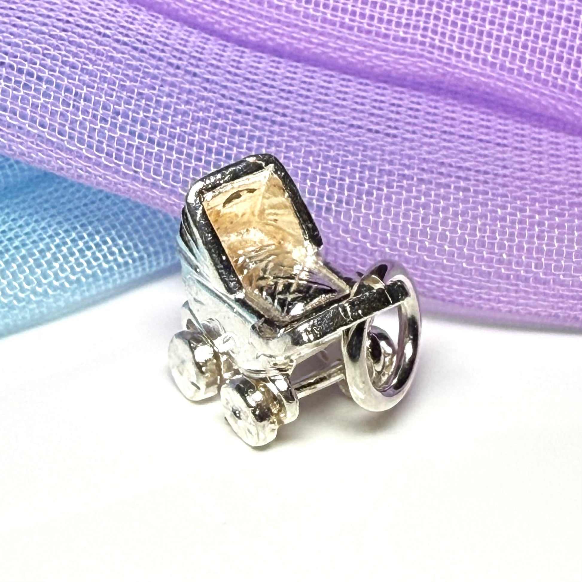 A Pram Shape Charm Sterling Silver