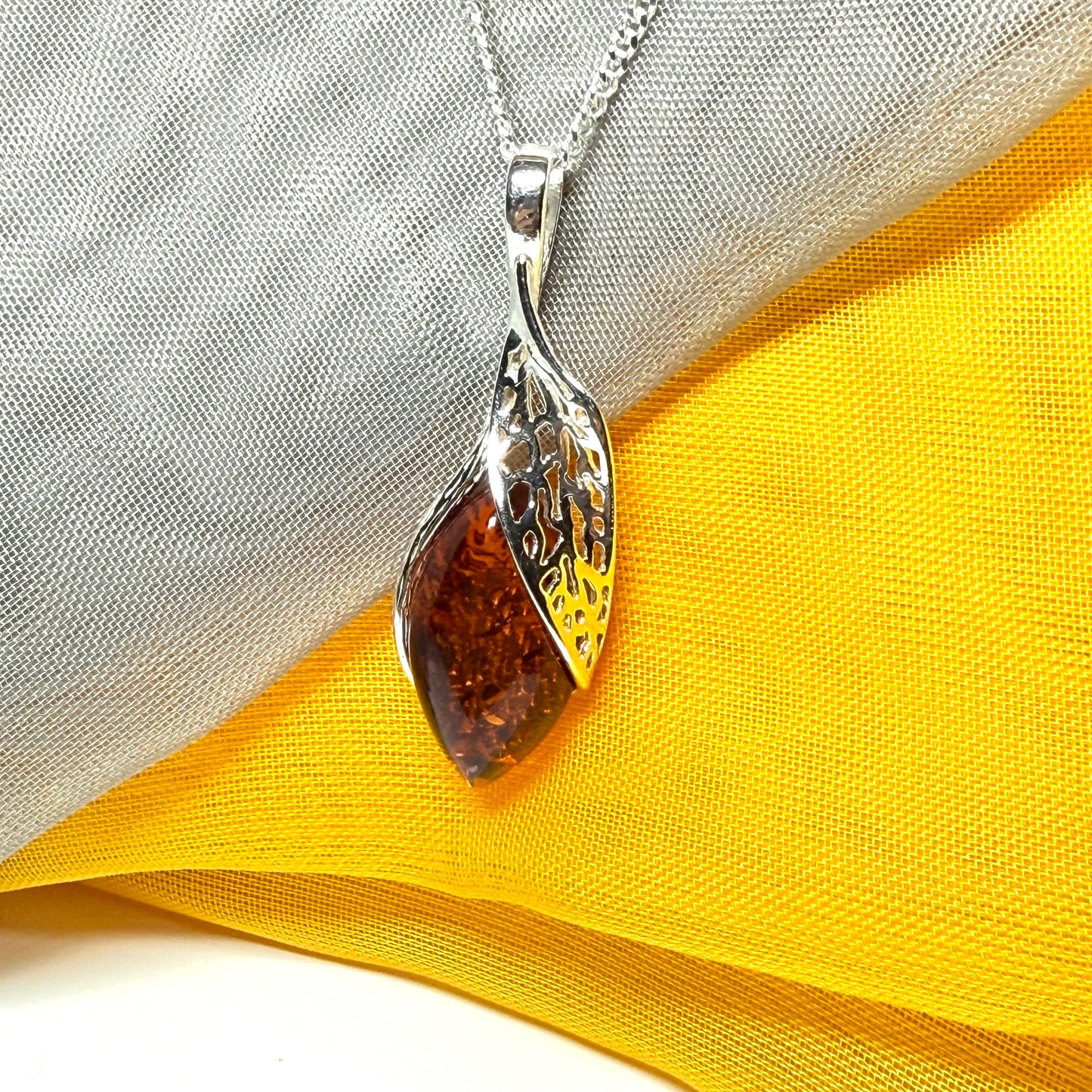 Real amber marquise sterling silver necklace with a swirl set fancy open pendant with chain