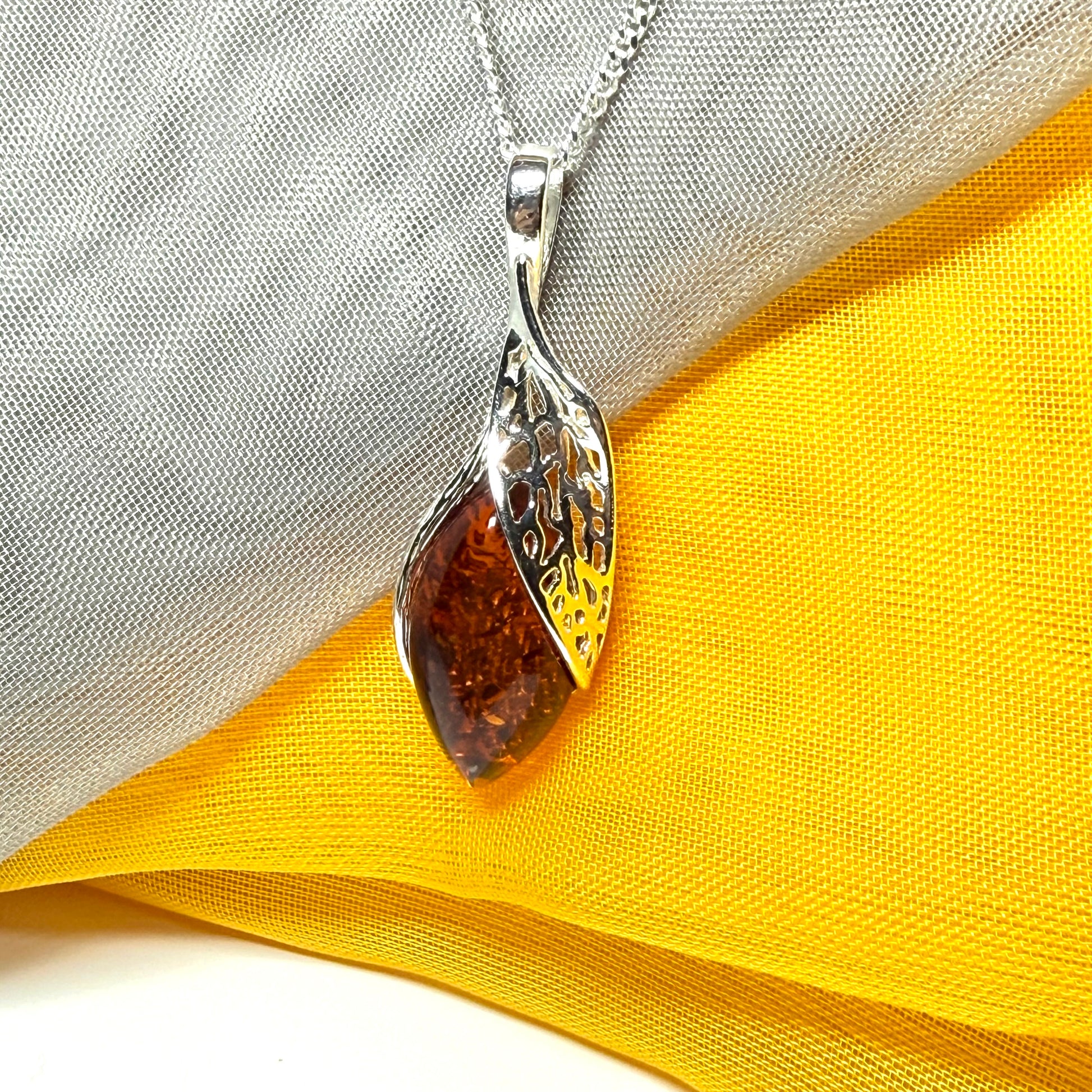 Real amber marquise sterling silver necklace with a swirl set fancy open pendant with chain