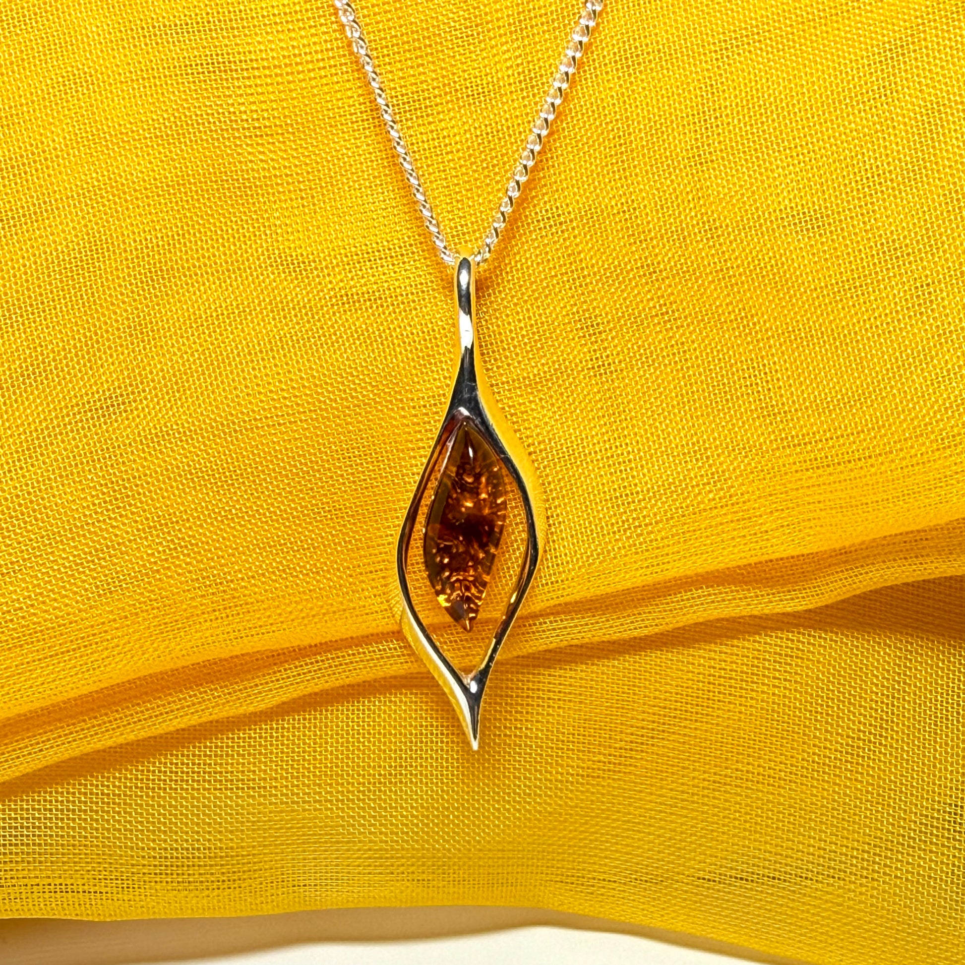 Real amber necklace sterling silver open twisted marquise shaped pendant With a chain Included