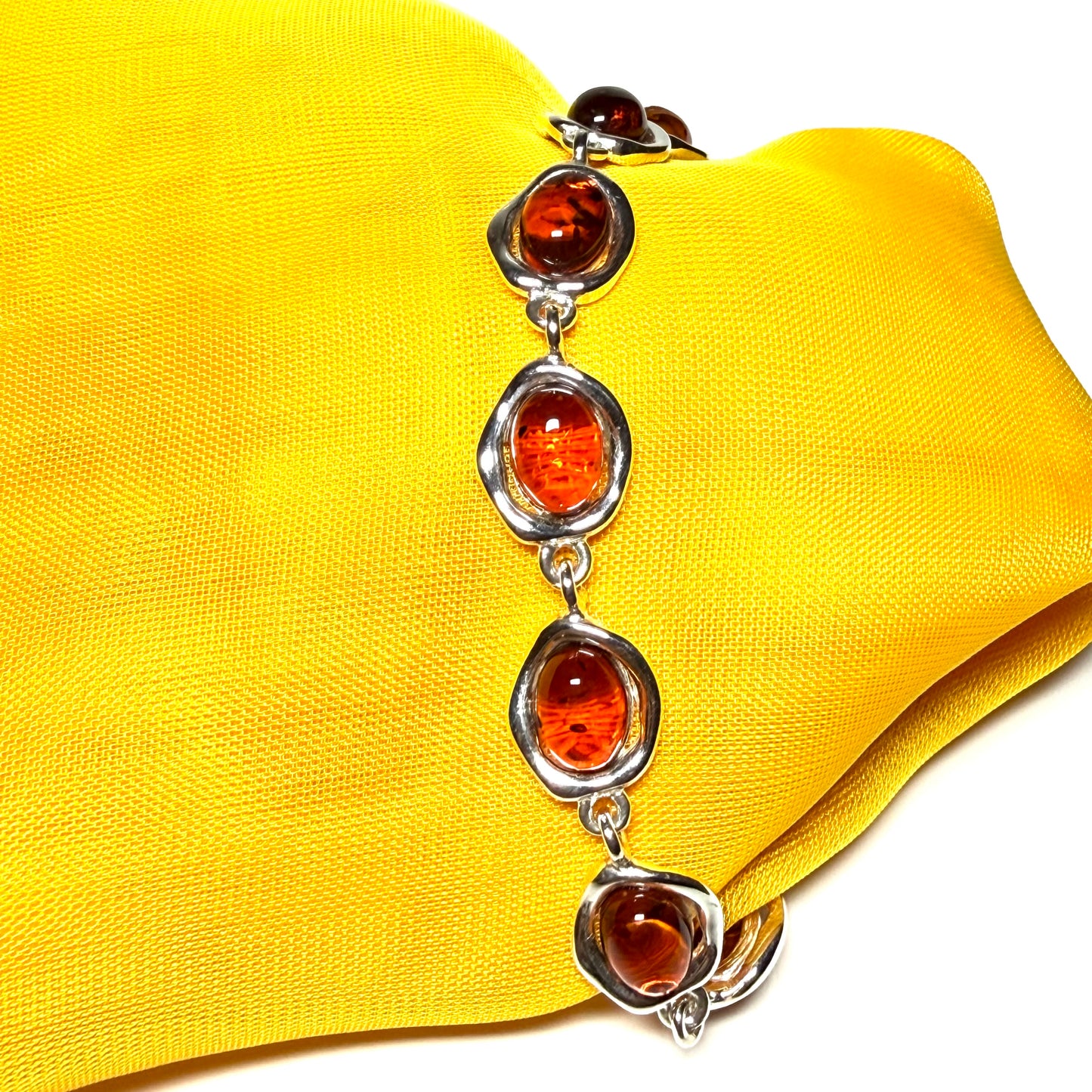 Real amber sterling silver fancy oval shaped bracelet