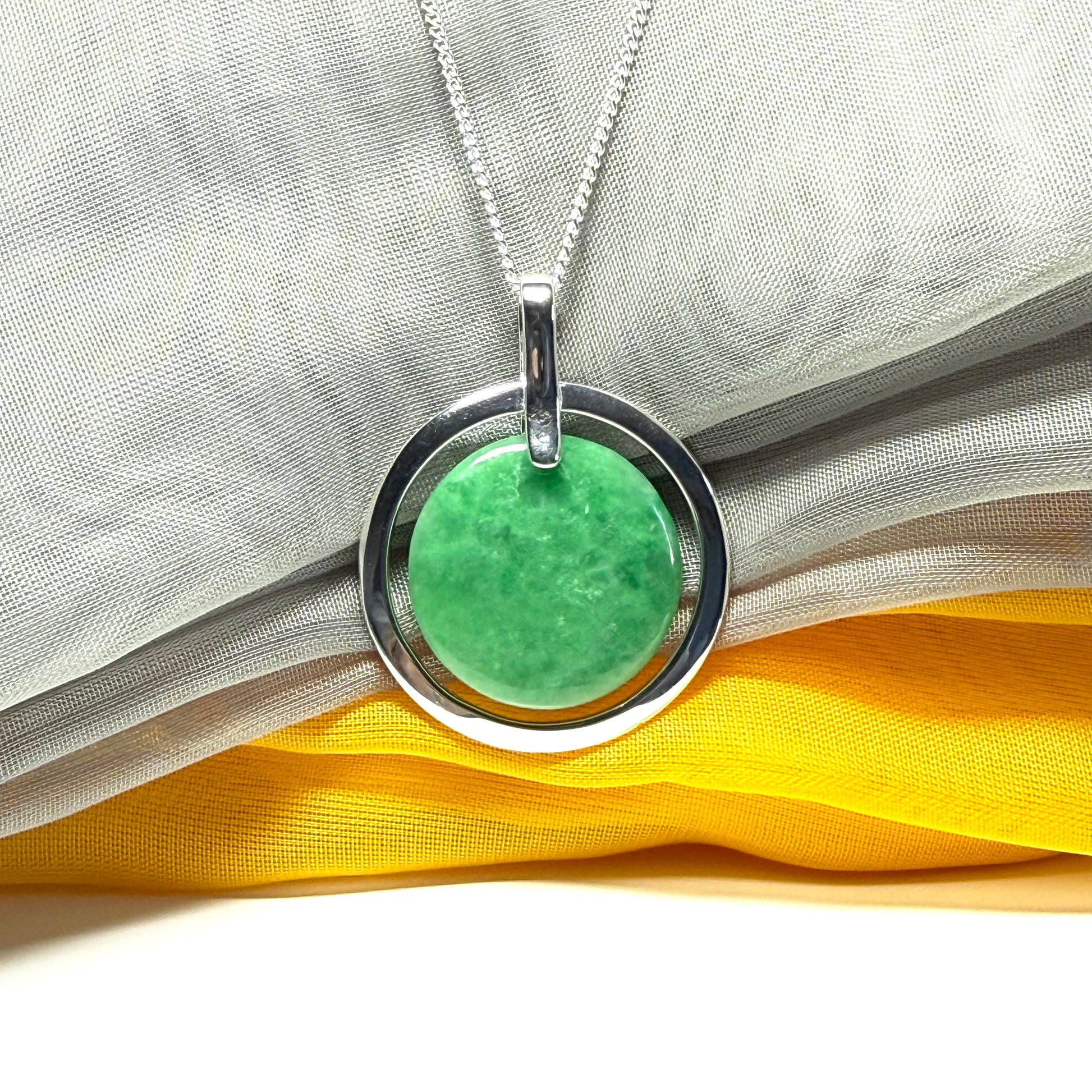 Real dark green jade necklace in a large round shape with a beautiful designed halo pendant with a chain included