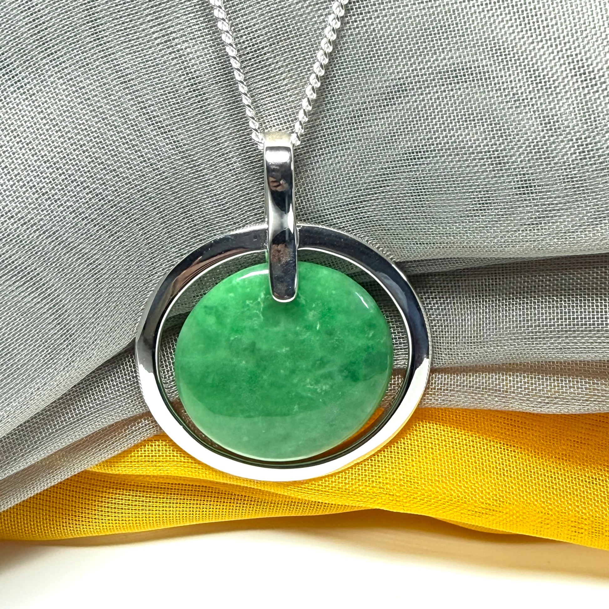 Real dark green jade necklace in a large round shape with a beautiful designed halo pendant with a chain included
