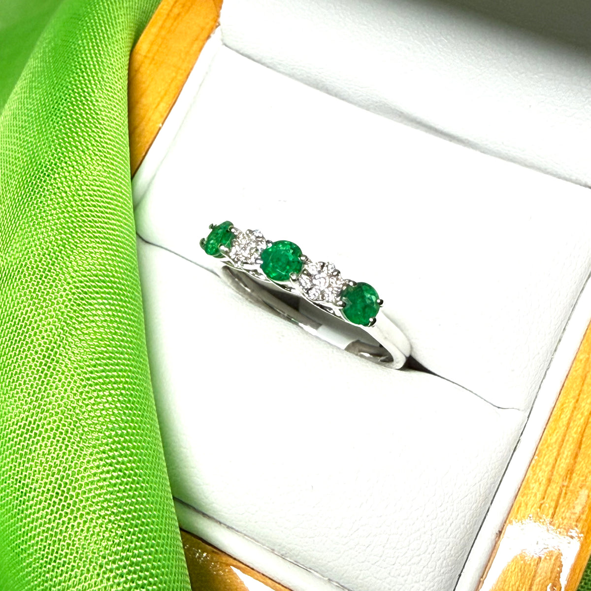 Real emerald and diamond white gold eternity ring claw setting