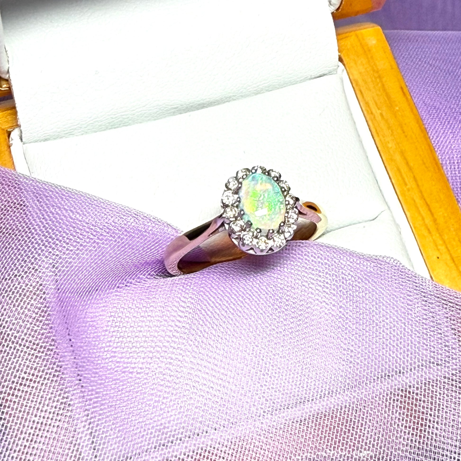Real oval opal and diamond yellow gold cluster ring
