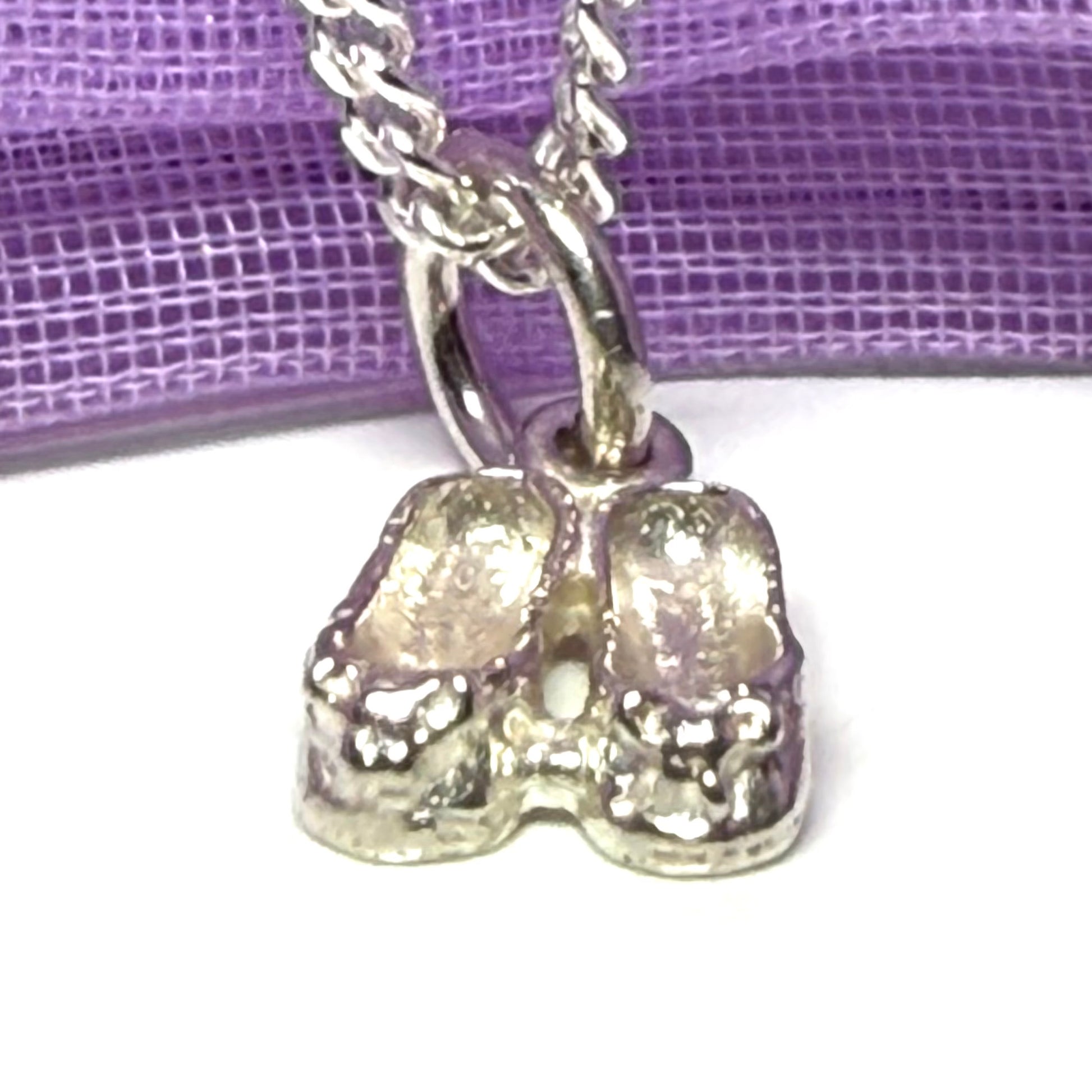Small ballerina slippers shaped sterling silver necklace