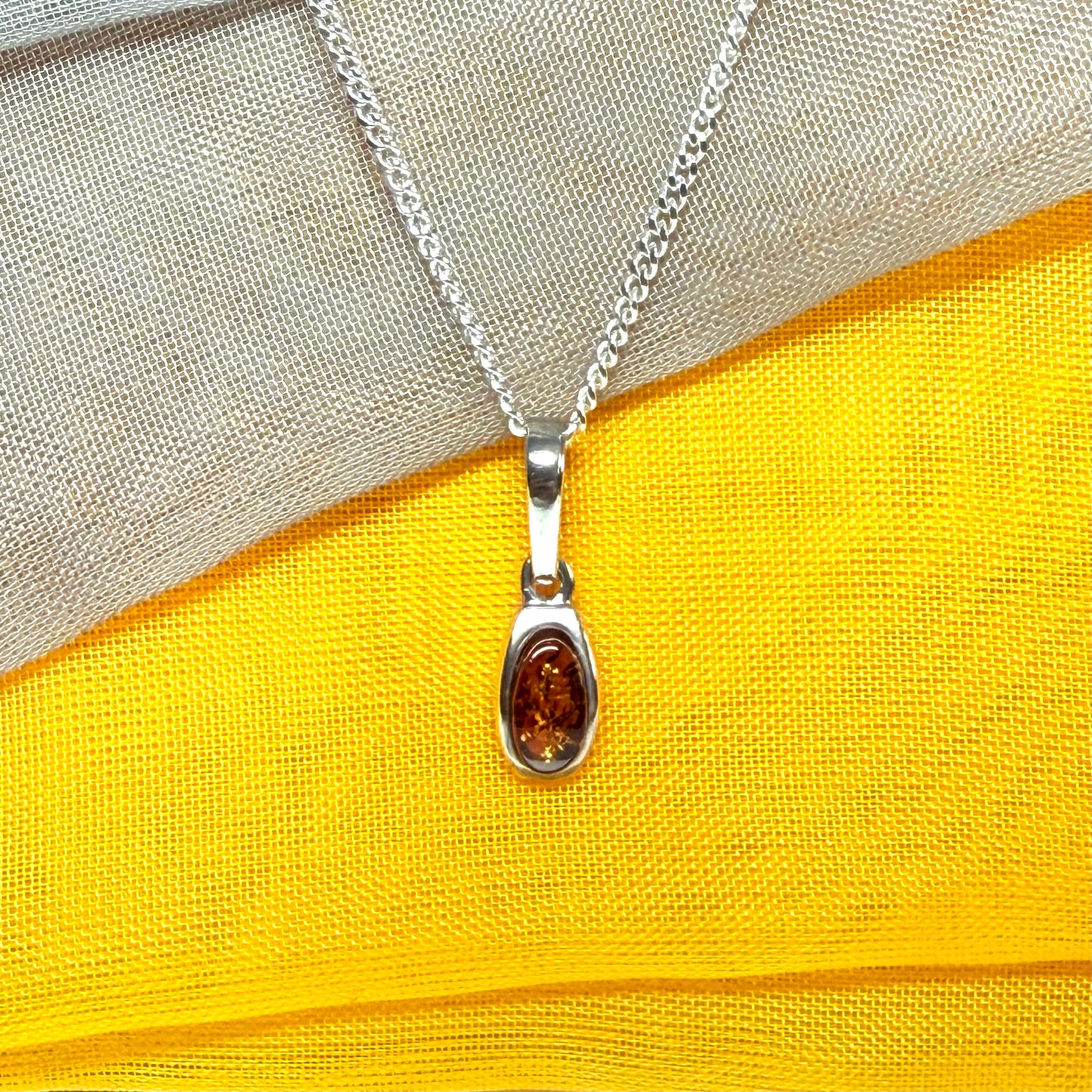 Small squared oval shaped real amber necklace pendant