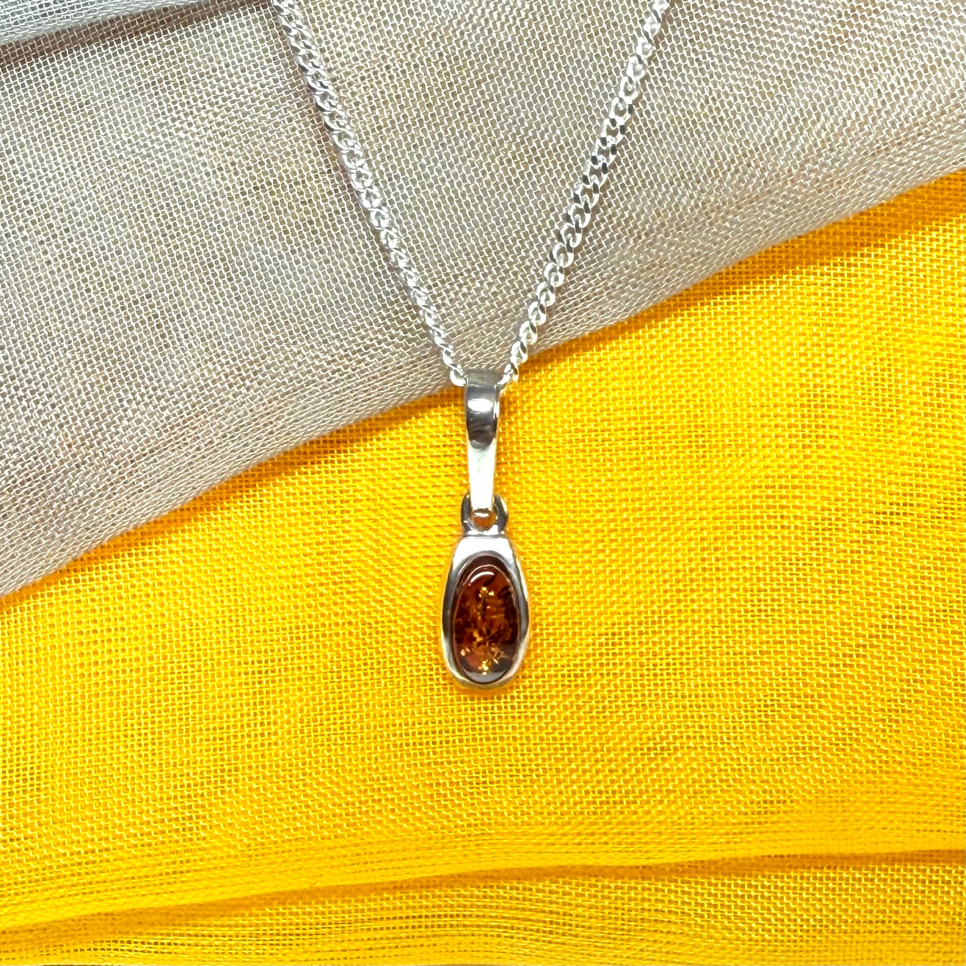 Small squared oval shaped real amber necklace pendant