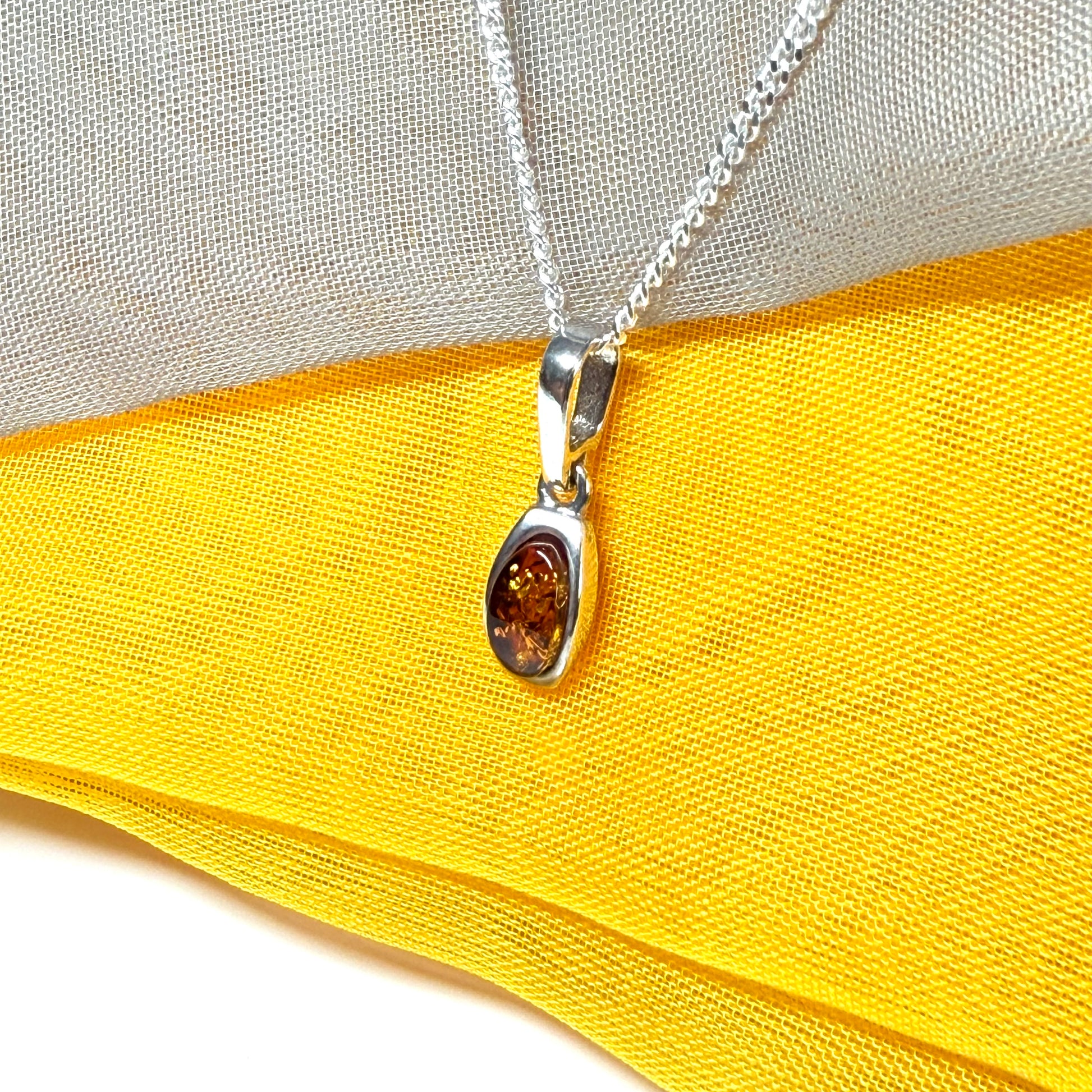 Small squared oval shaped real amber necklace pendant
