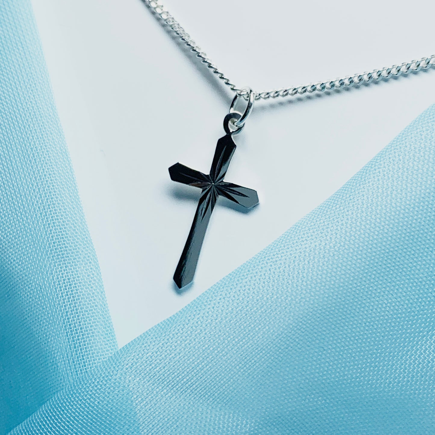 Small sterling silver diamond cut cross necklace including chain