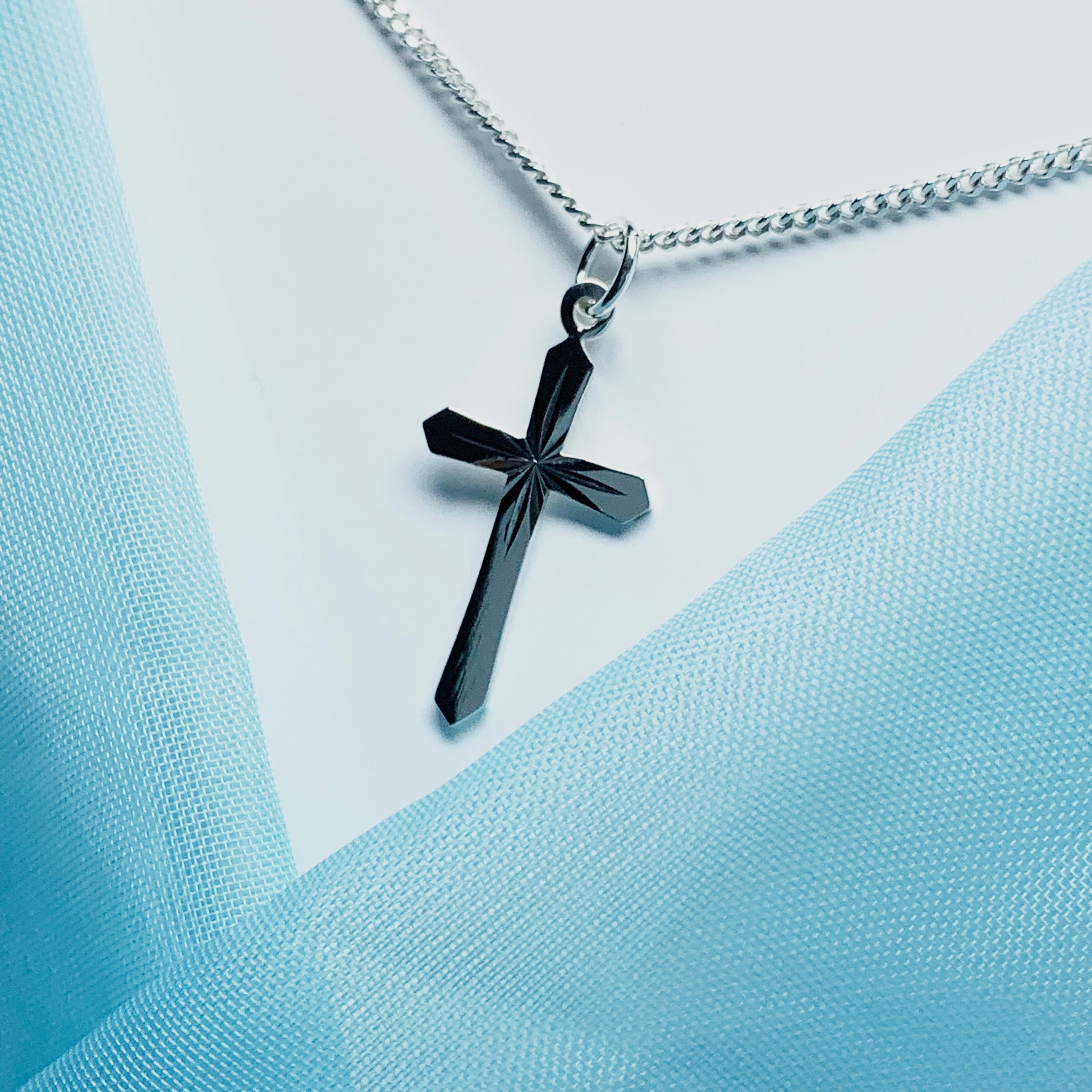 Small sterling silver diamond cut cross necklace including chain