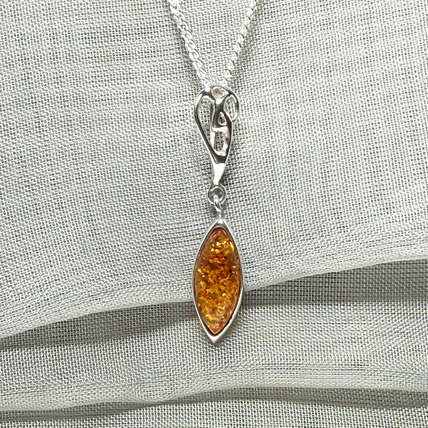 Sterling silver real amber marquise shaped necklace swirled open swirl pendant