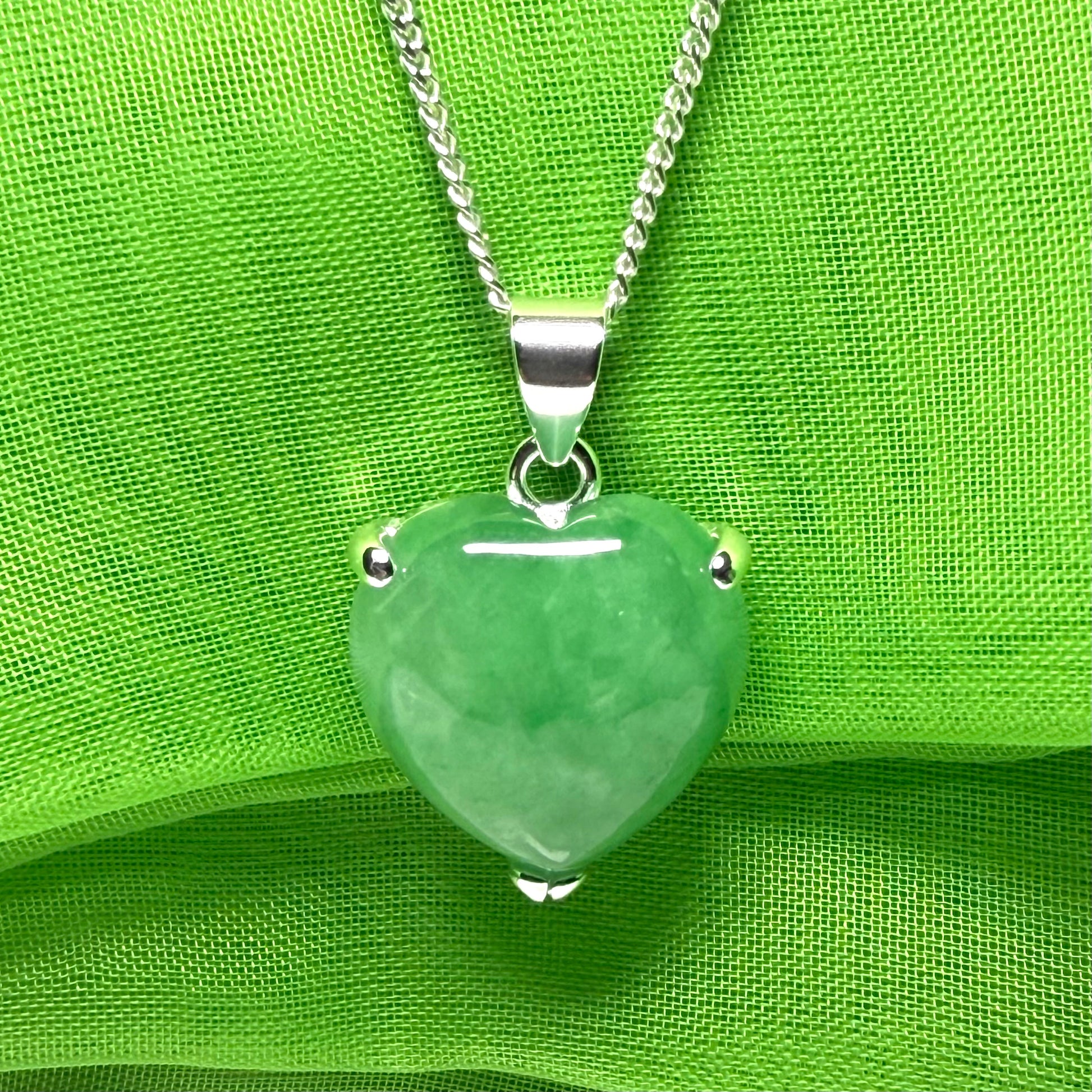 A beautiful and stunning real green jade necklace heart shaped sterling silver pendant