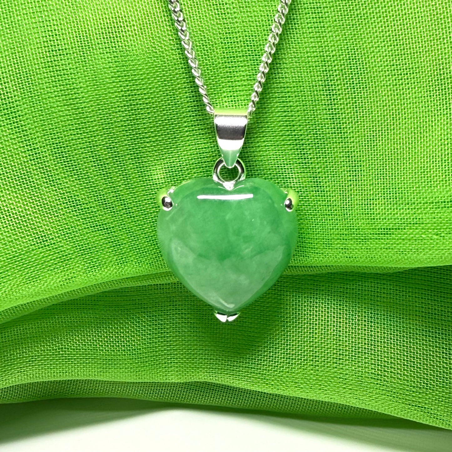 A beautiful and stunning real green jade necklace heart shaped sterling silver pendant