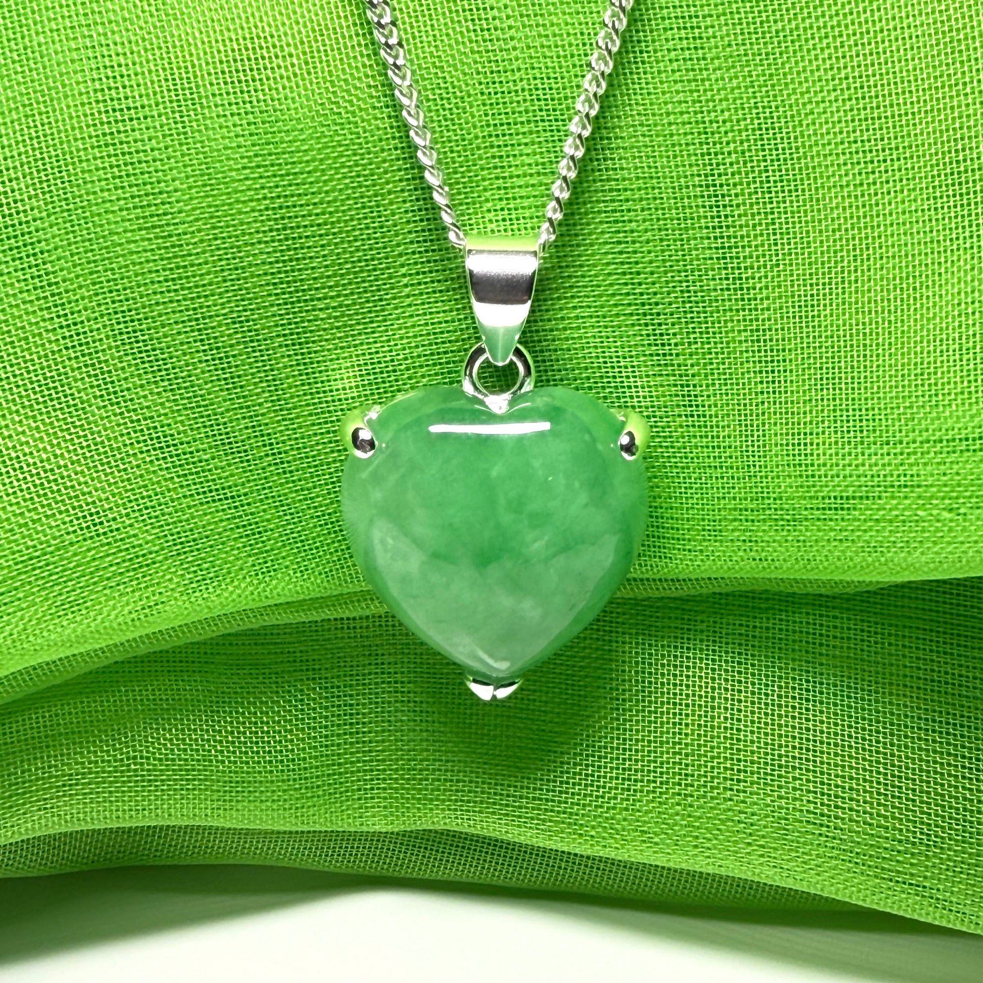 A beautiful and stunning real green jade necklace heart shaped sterling silver pendant
