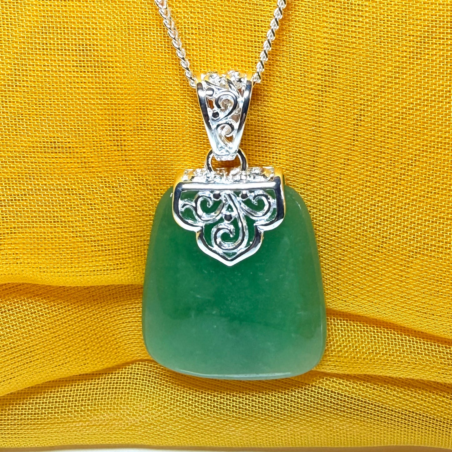 A beautiful and stunning real green jade necklace large pendant that is cushion in shape