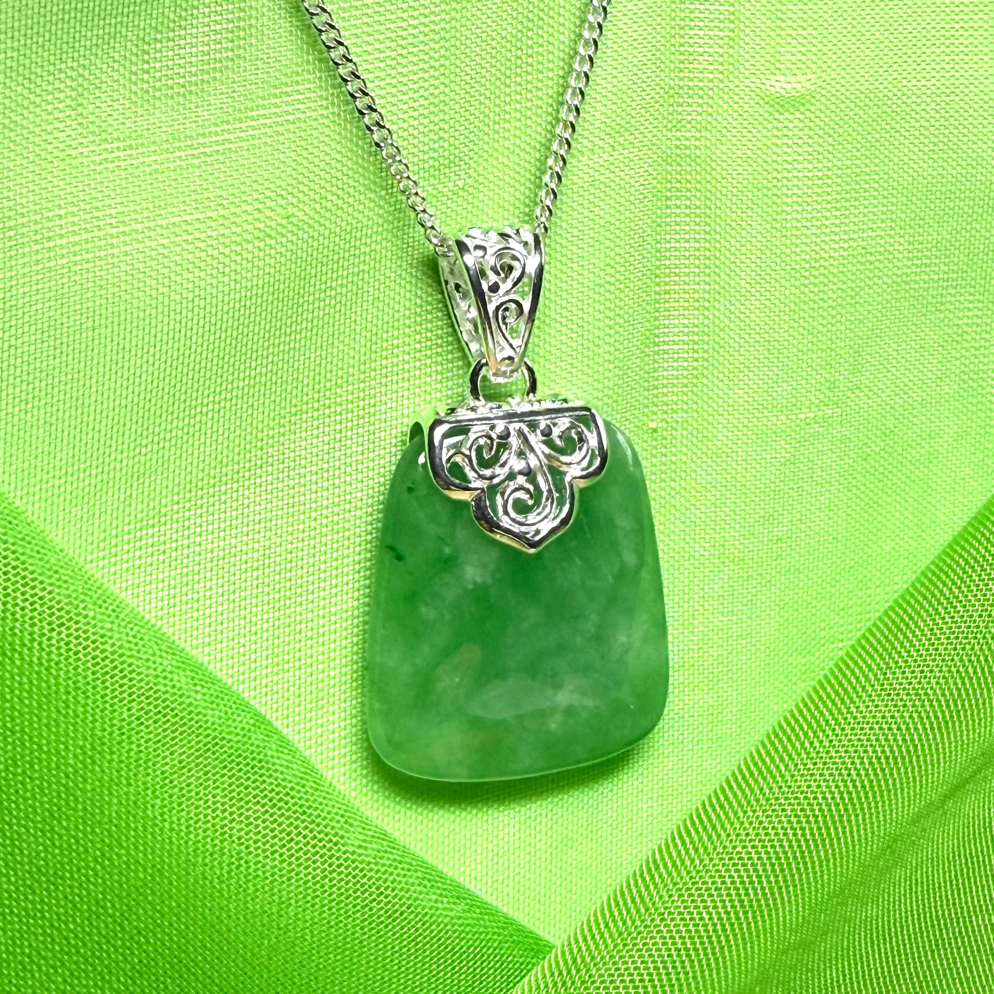 A beautiful and stunning real green jade necklace large pendant that is cushion shaped