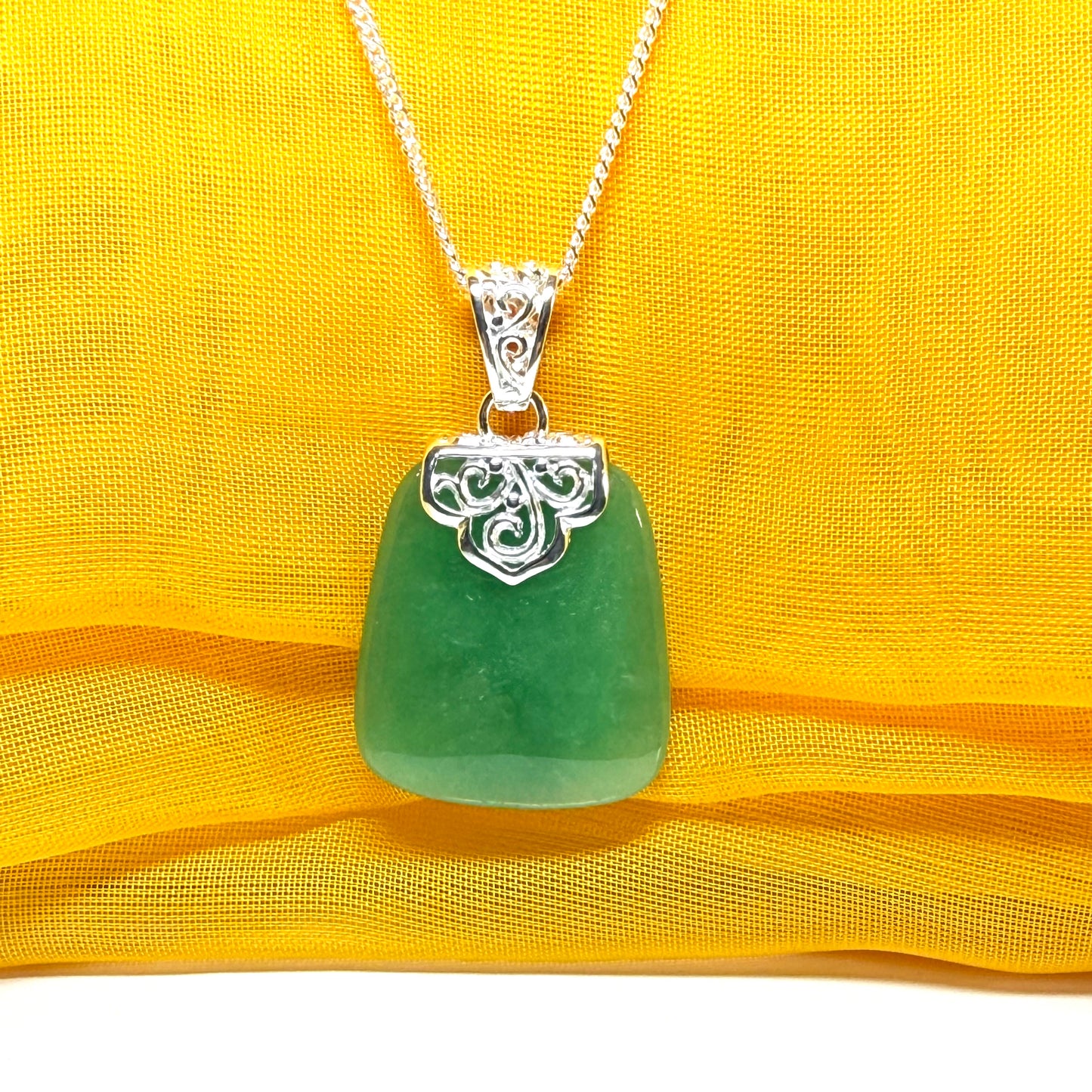 A beautiful and stunning real green jade necklace large pendant that is cushion in shape