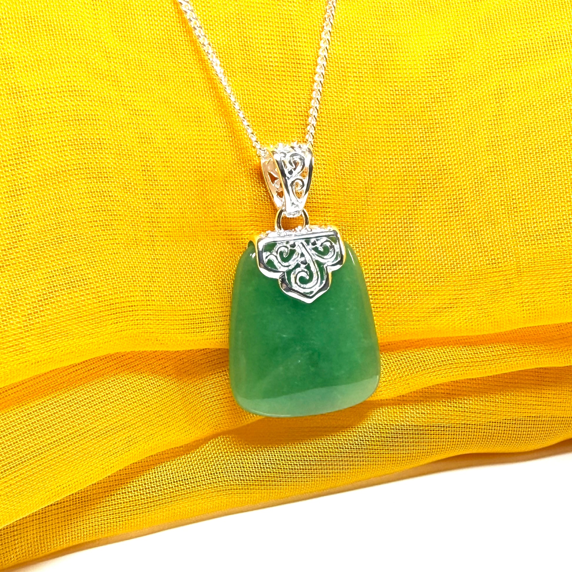 A beautiful and stunning real green jade necklace large pendant that is cushion in shape
