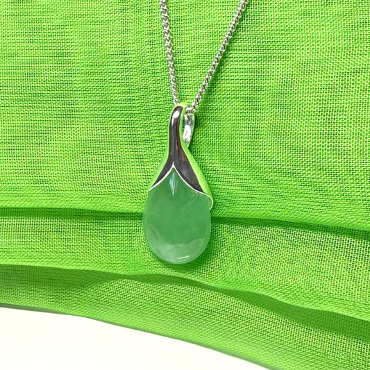 A beautiful and stunning real green jade pendant necklace in a teardrop shaped or pear shaped design