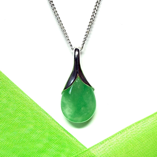 A beautiful and stunning real green jade pendant necklace in a teardrop shaped or pear shaped design