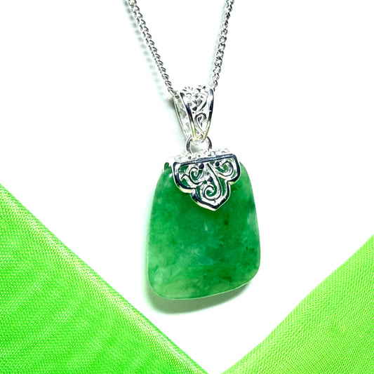 A beautiful and timeless real green jade necklace large cushion shaped with a chain included