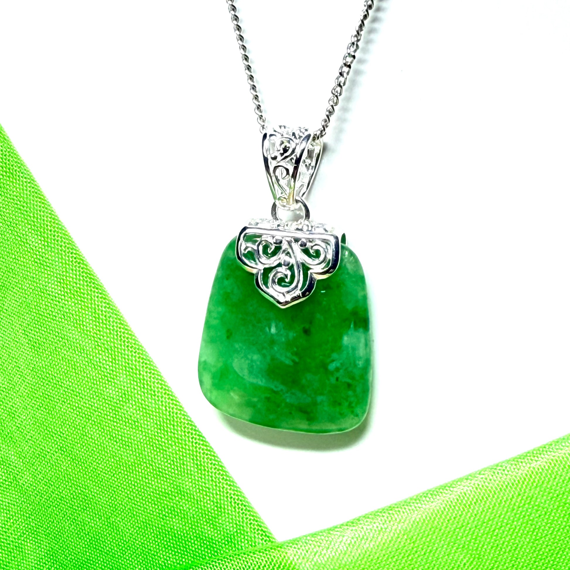 A beautiful and timeless real green jade necklace large cushion shaped with a chain included