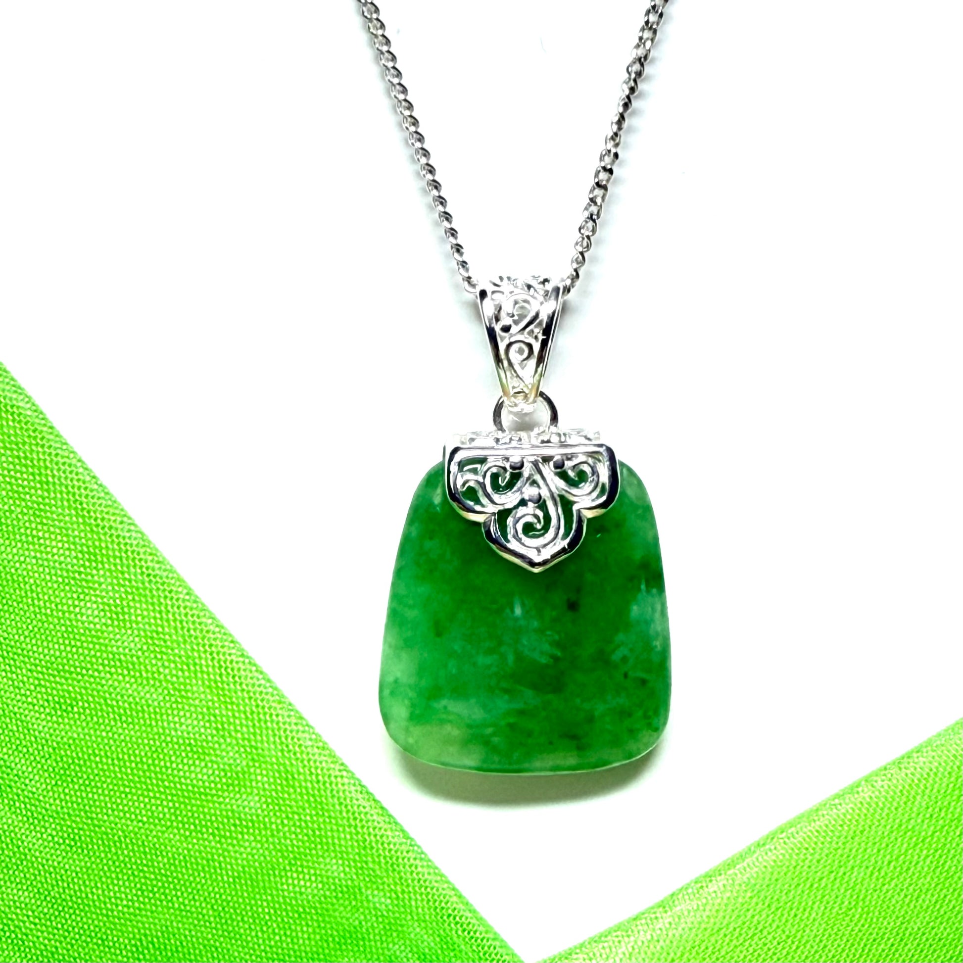A beautiful and timeless real green jade necklace large cushion shaped with a chain included
