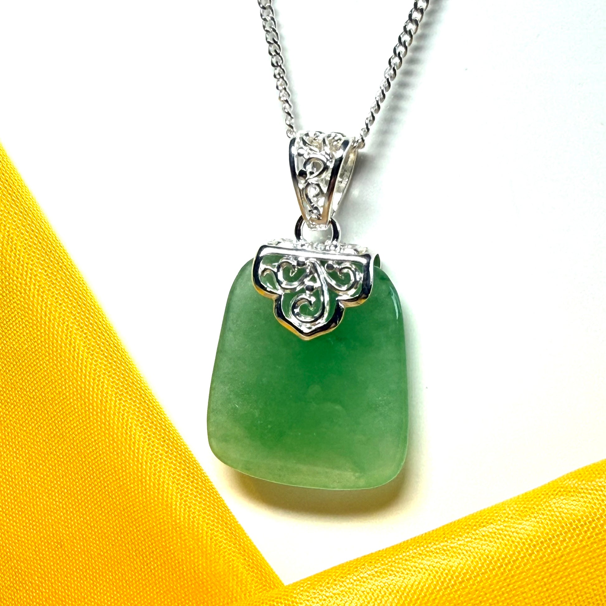 Beautiful and timeless real green jade necklace large pendant that is cushion shaped