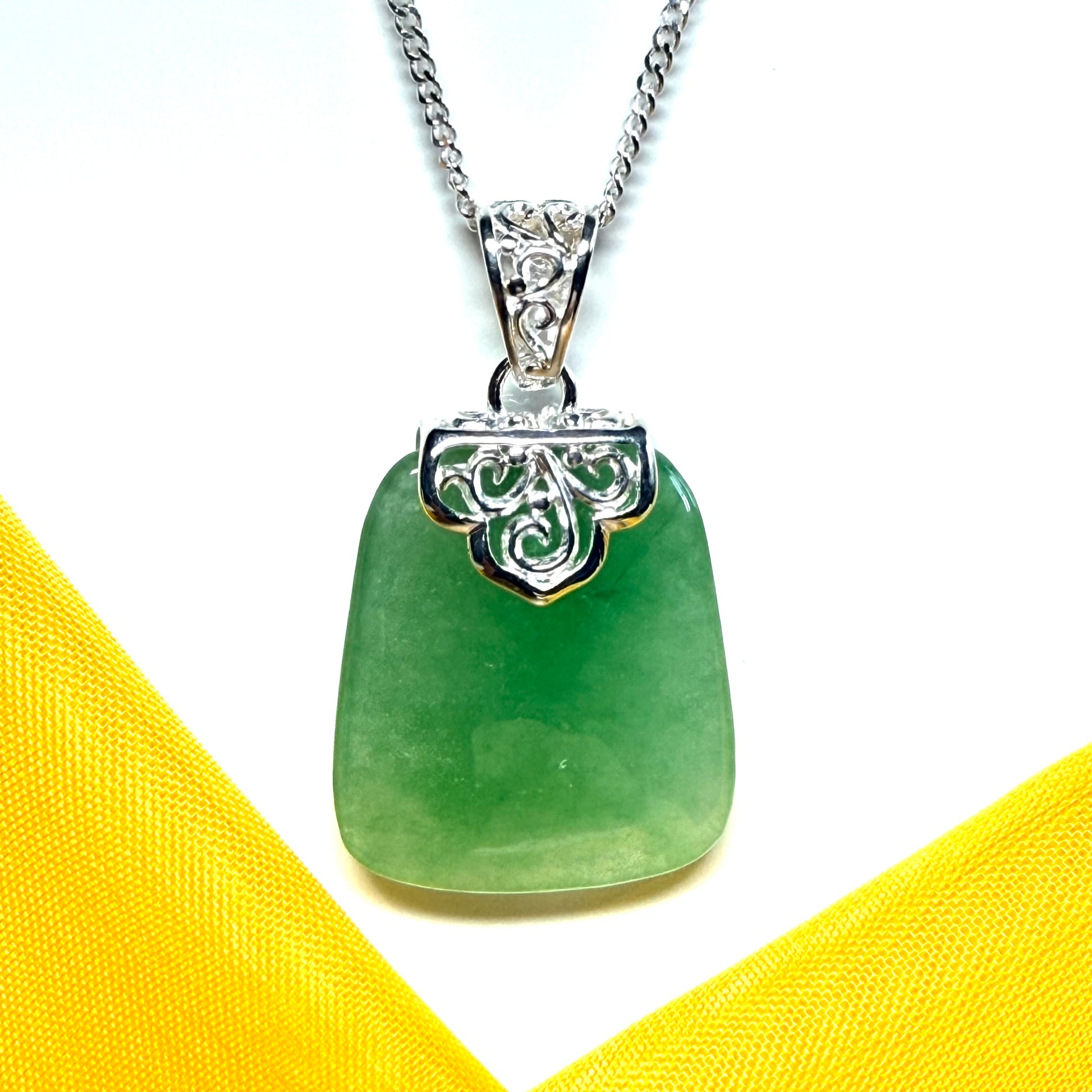 Beautiful and timeless real green jade necklace large pendant that is cushion shaped