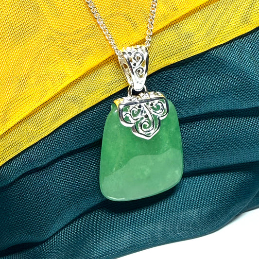A beautiful and truly timeless real green jade necklace large pendant that is cushion shaped