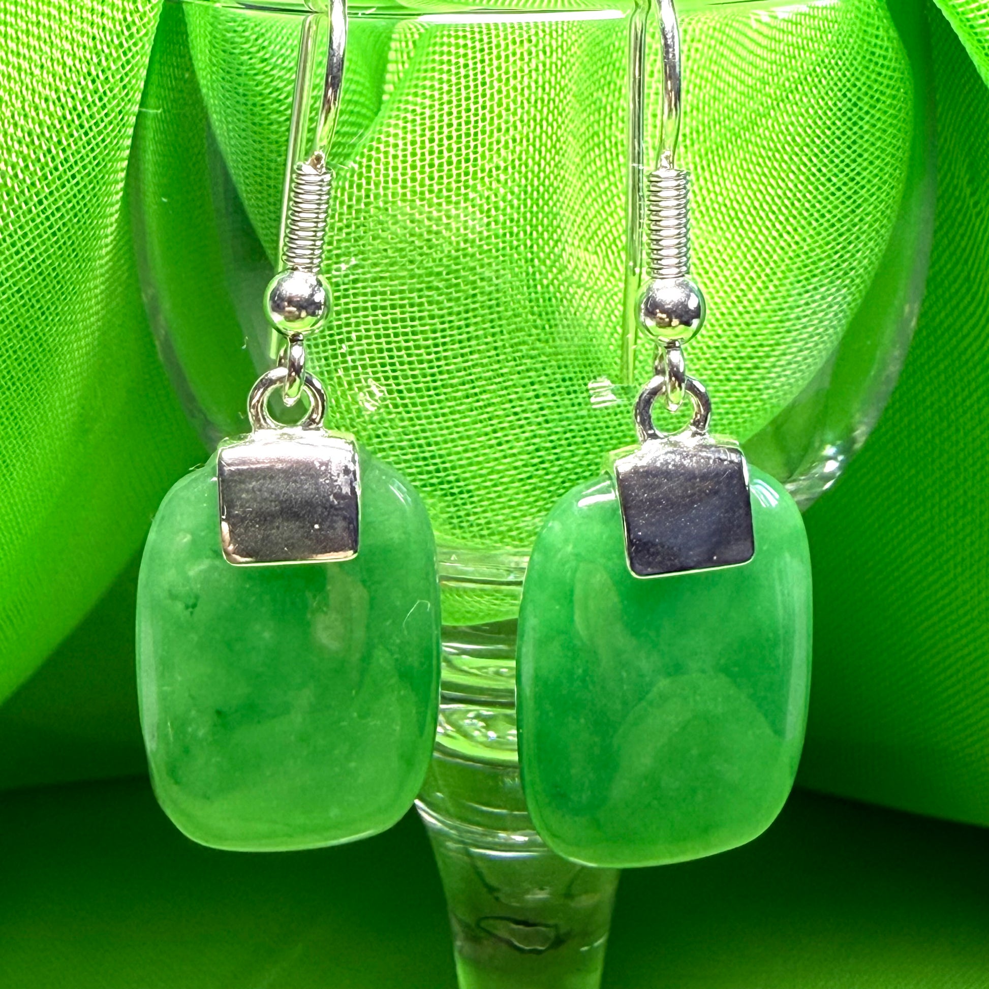 A beautiful pair of real green jade silver cushion shaped dropped earrings