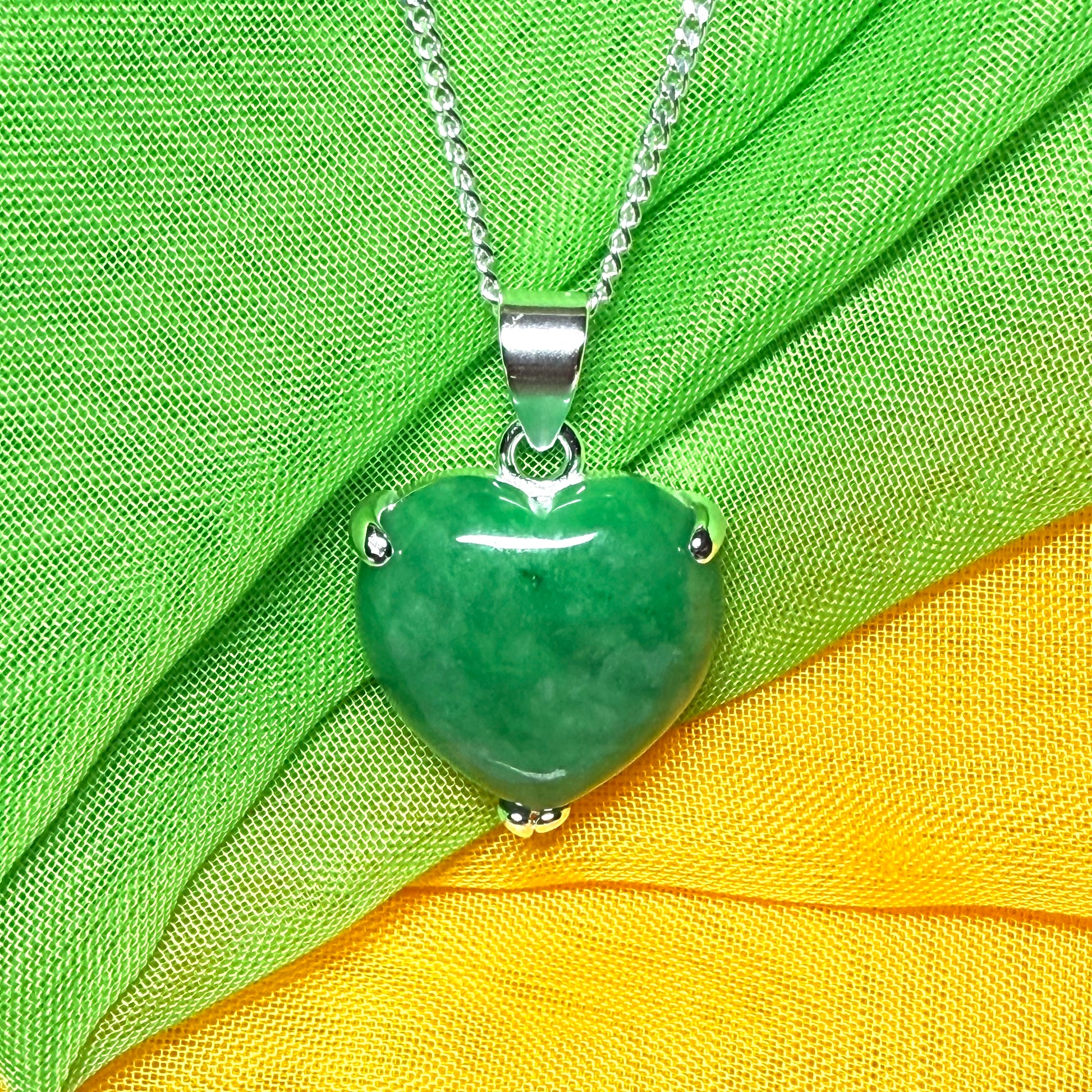 A beautiful real green jade necklace heart shape sterling silver pendant
