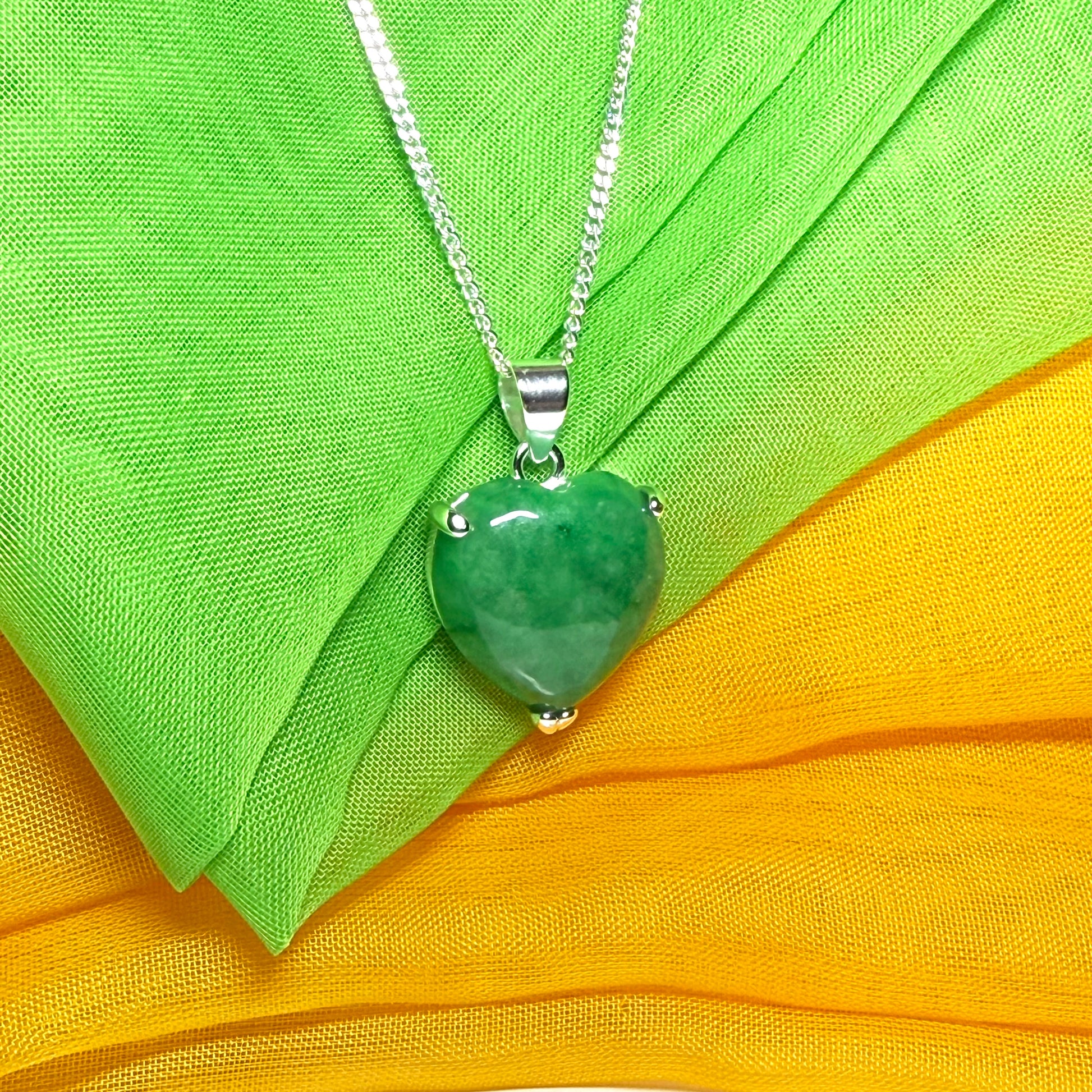 A beautiful real green jade necklace heart shape sterling silver pendant